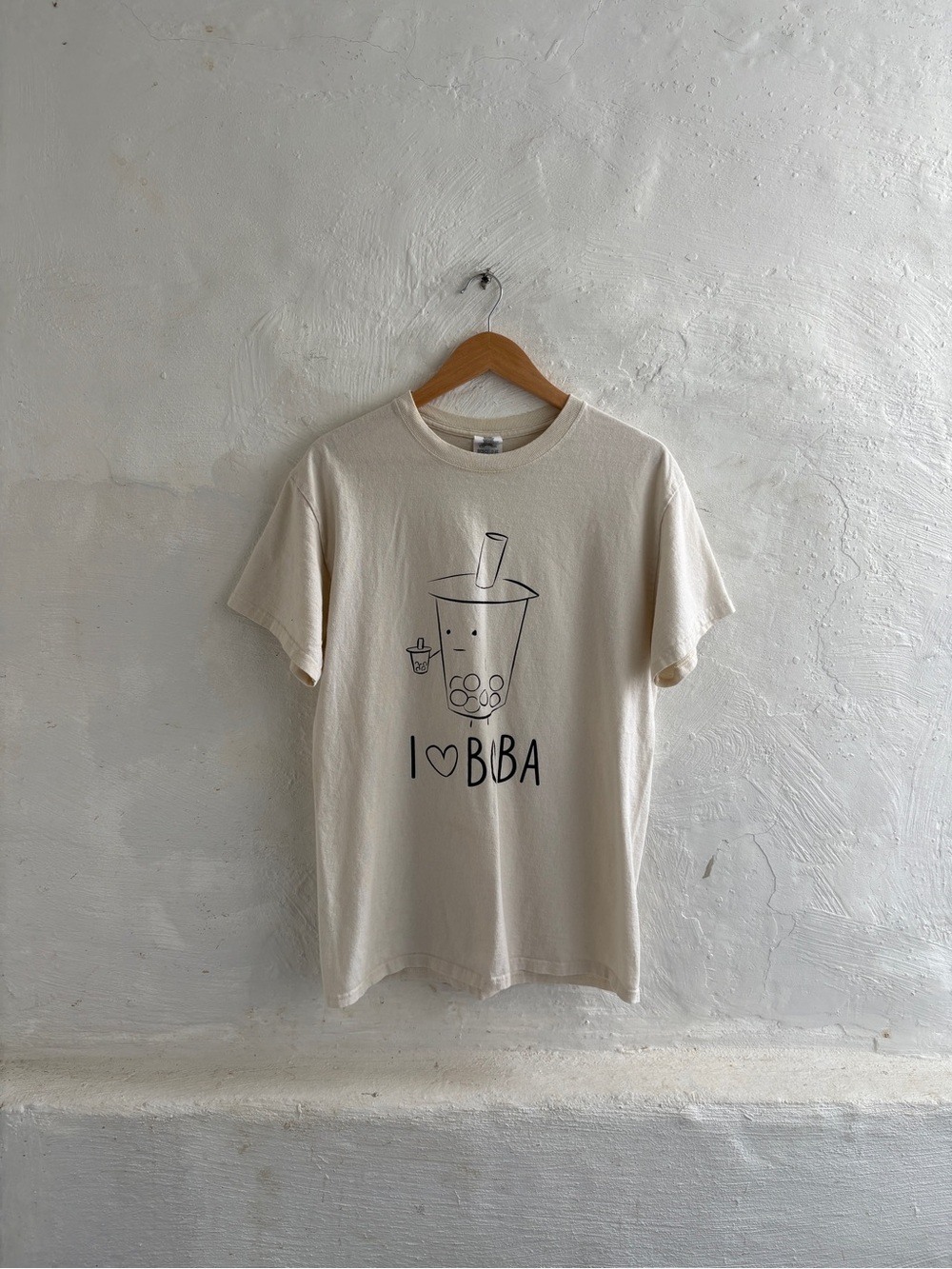 Woman’s size Medium cream-colored short-sleeve Boba graphic t-shirt
